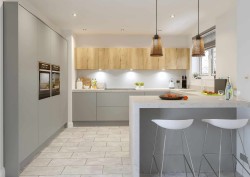 Grey kitchen with wood effect cupboards